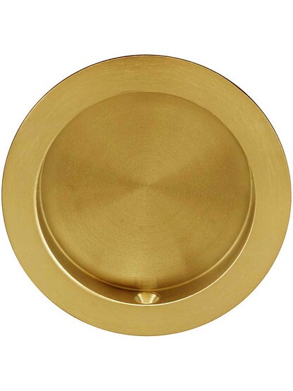 Round Pocket-Door Flush Pull in Aged Brass.